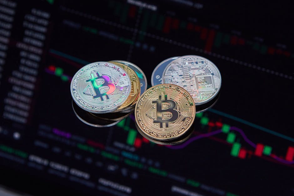 Close-up of Bitcoin cryptocurrency coins with a digital market chart background, symbolizing finance and technology trends.